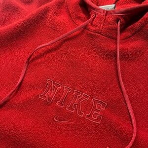 Red Nike fleece hoodie with embroidered spellout